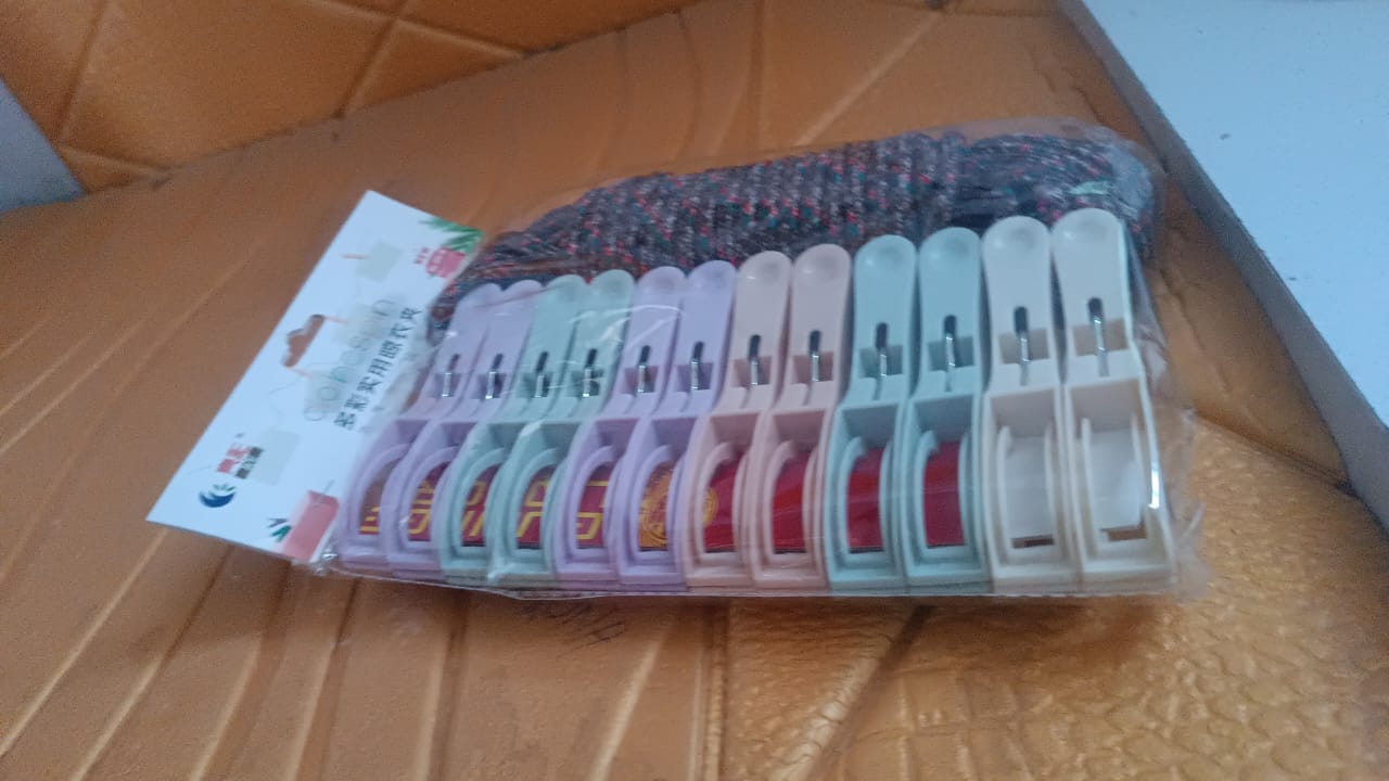 Cloth drying rope with clips installed on a balcony for drying clothes