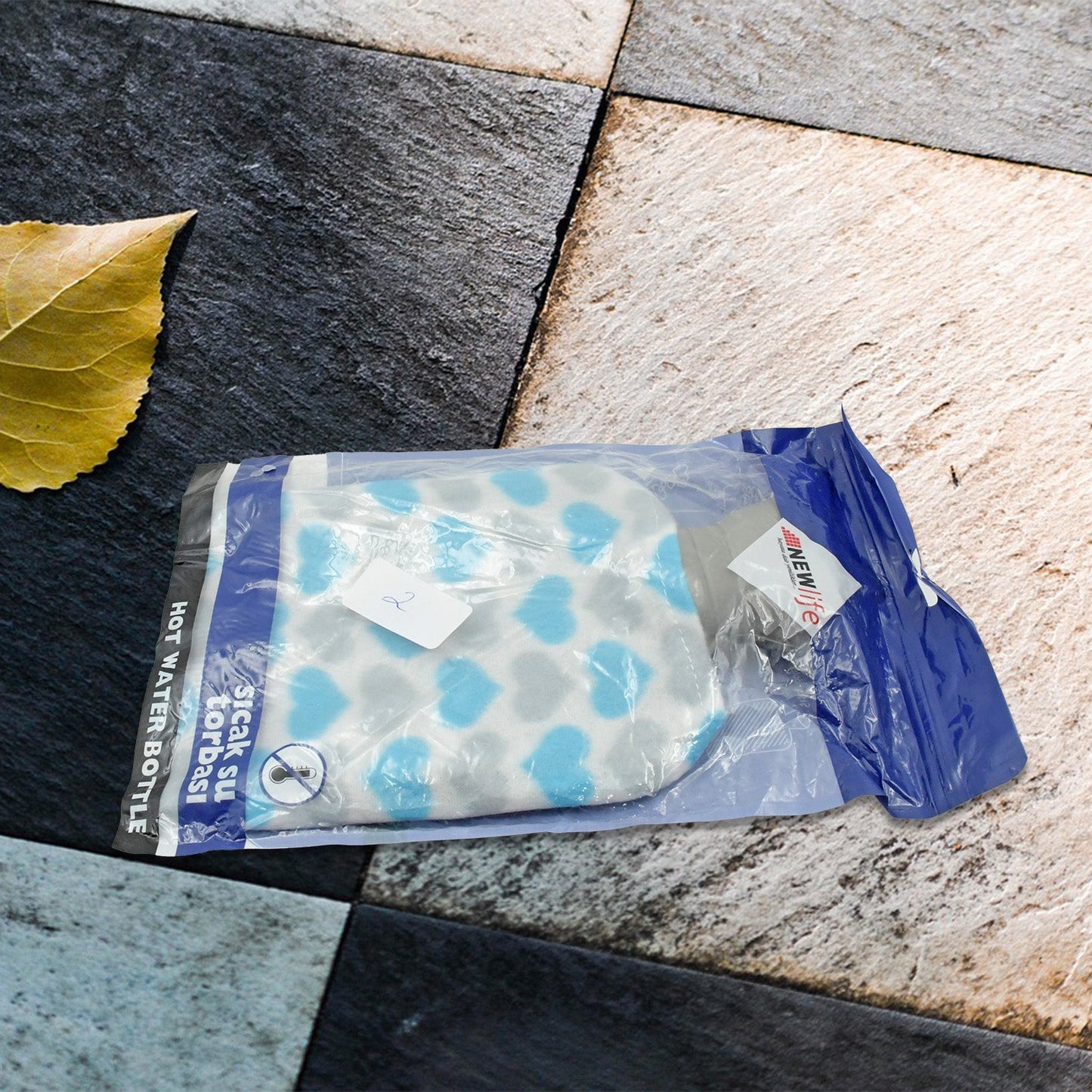 Angled view of the leak-proof hot water bag, showcasing its ergonomic design.