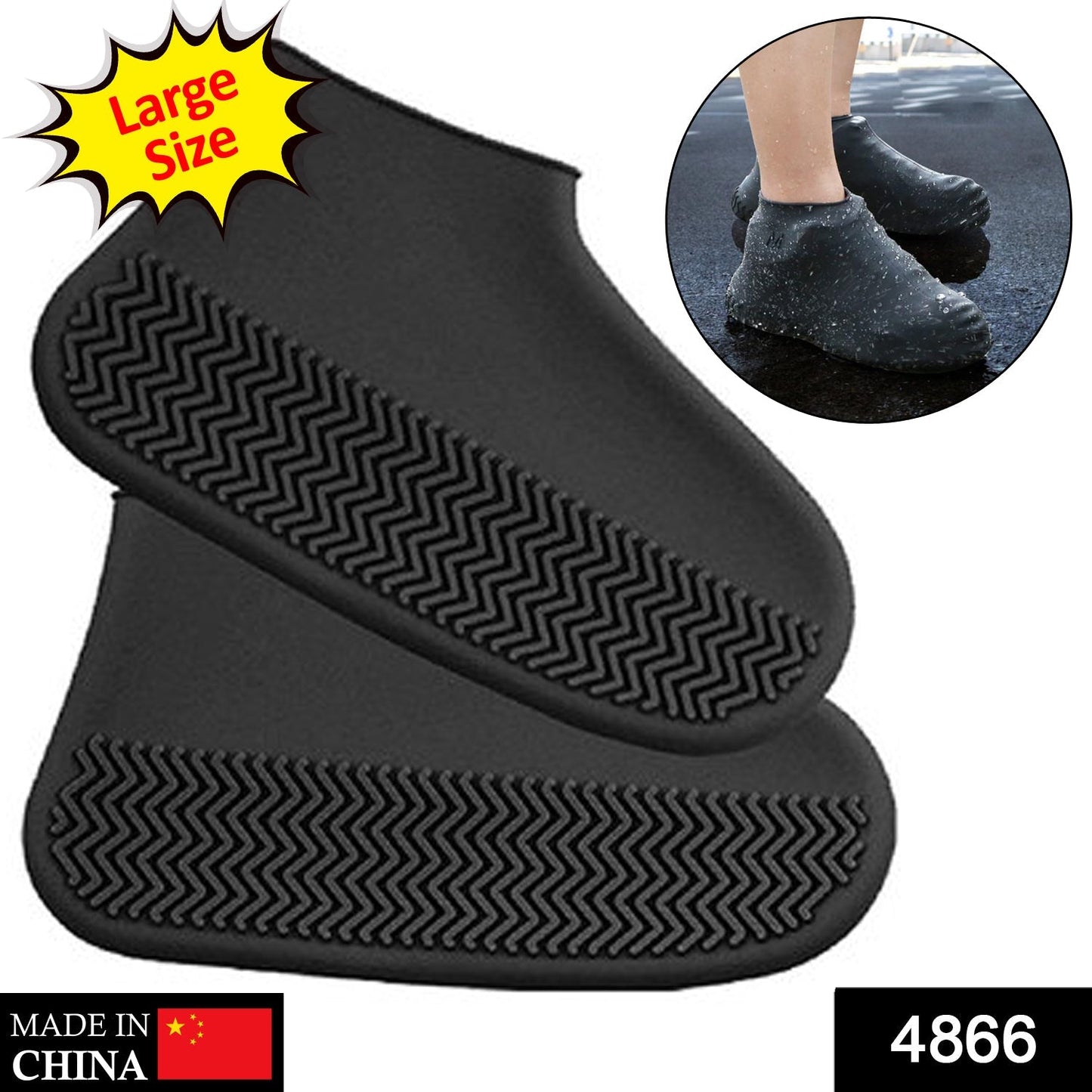 A person's feet wearing black silicone shoe covers stand on a wet wooden deck.