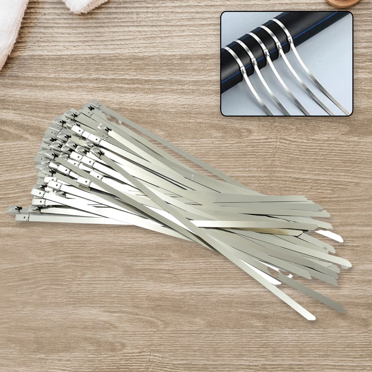 Multiple stainless steel cable ties used for organizing wires in an industrial setting, highlighting their strength.