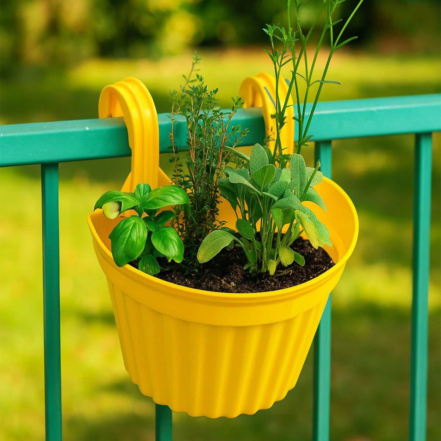 Multicolor hanging plastic planter with a lush green plant, designed for balconies.