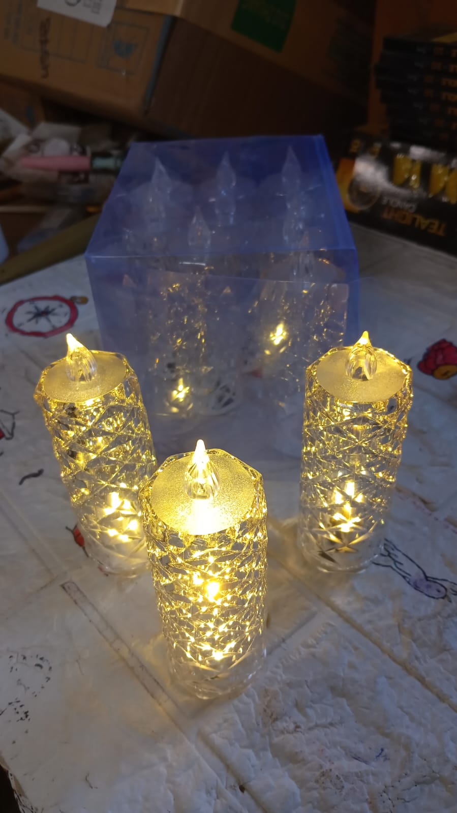 Transparent acrylic LED rose candle with a warm glow, suitable for Diwali and Christmas.