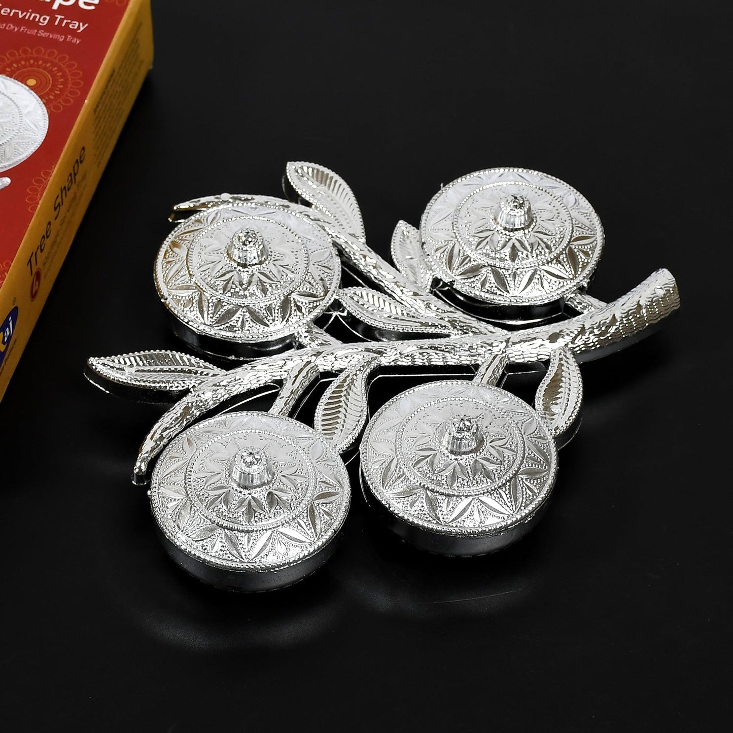 Angled view showcasing the unique tree shape and lid design of the decorative serving tray.