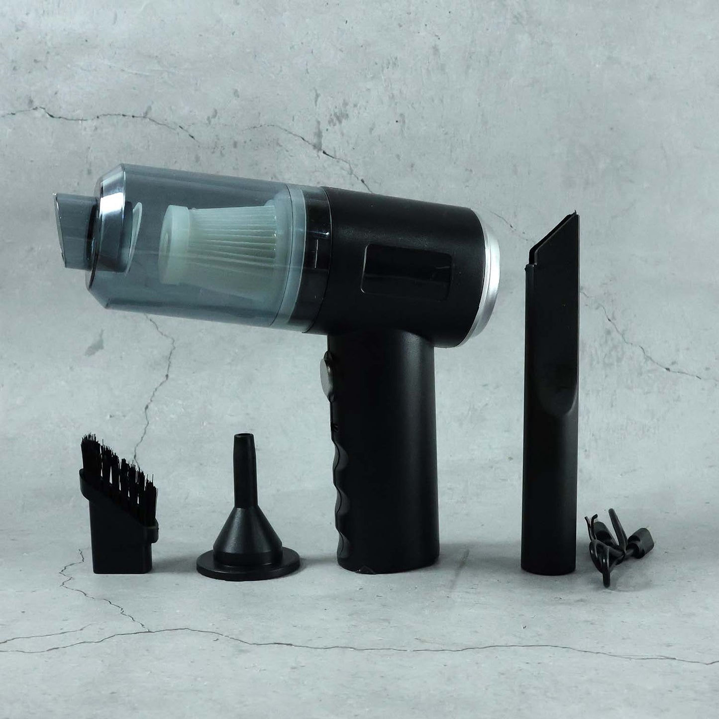Close-up of the Mini Car Vacuum's nozzle and brush attachments.