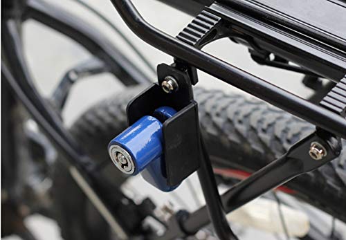 A blue wheel security device is attached to a bicycle's rear rack, with a tire and spokes visible in the background.