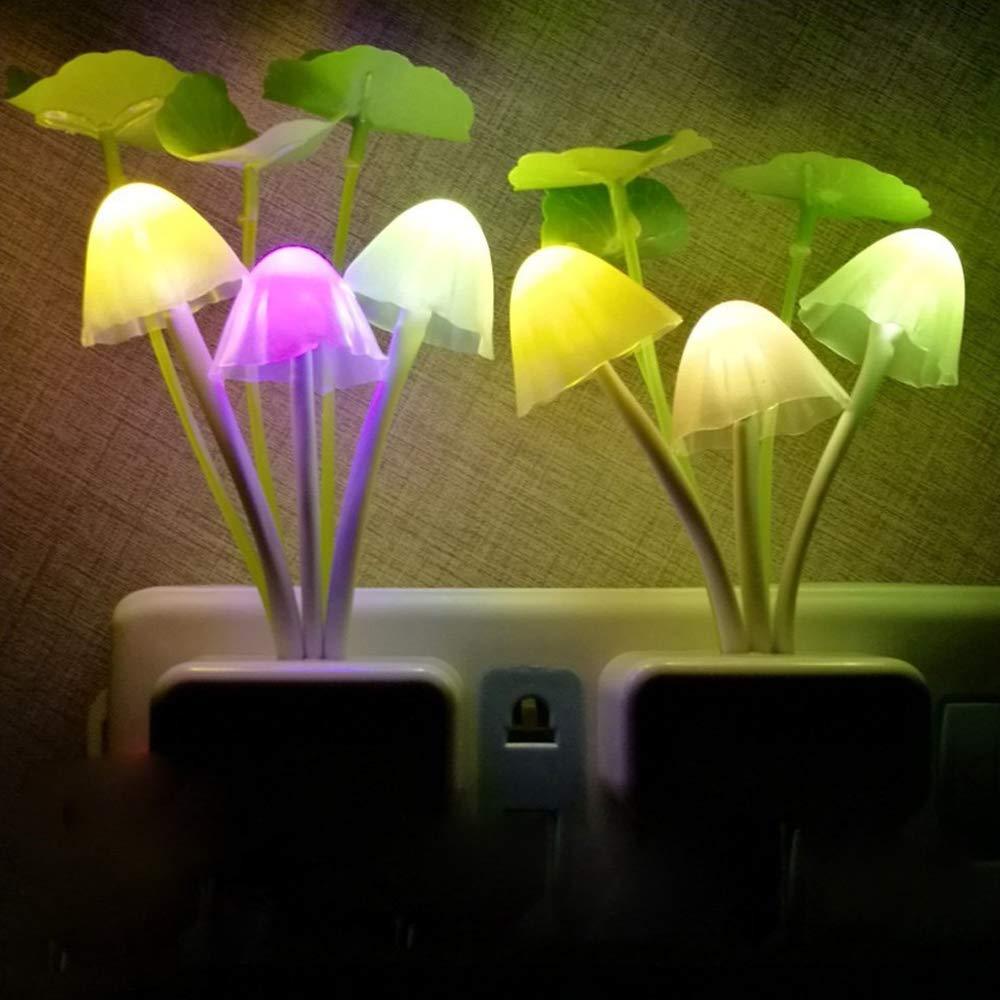 mushroom night light illuminating a dark room with ambient light.