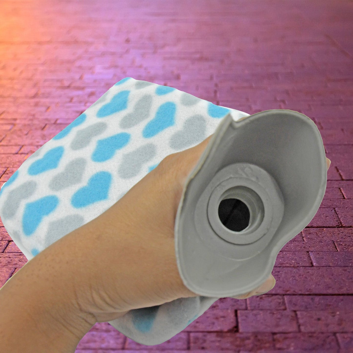 Close-up of the hot water bag's secure cap and soft, removable cover.