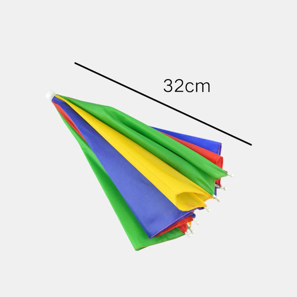 A folded, colorful red, yellow, green, and blue umbrella hat is shown at an angle, with a black line indicating a 32cm