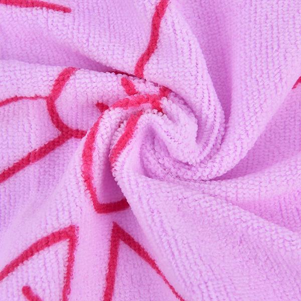Woman comfortably wrapped in a quick-drying cotton bath towel.