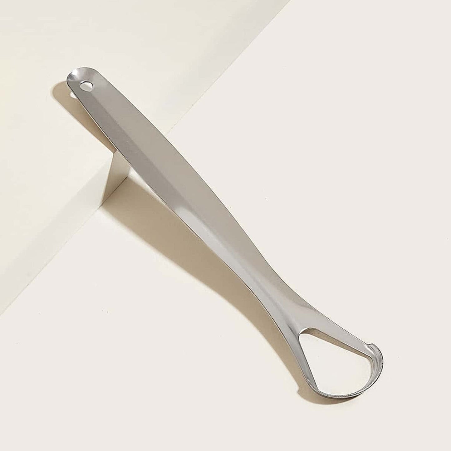Stainless steel tongue scraper with its metal travel case.