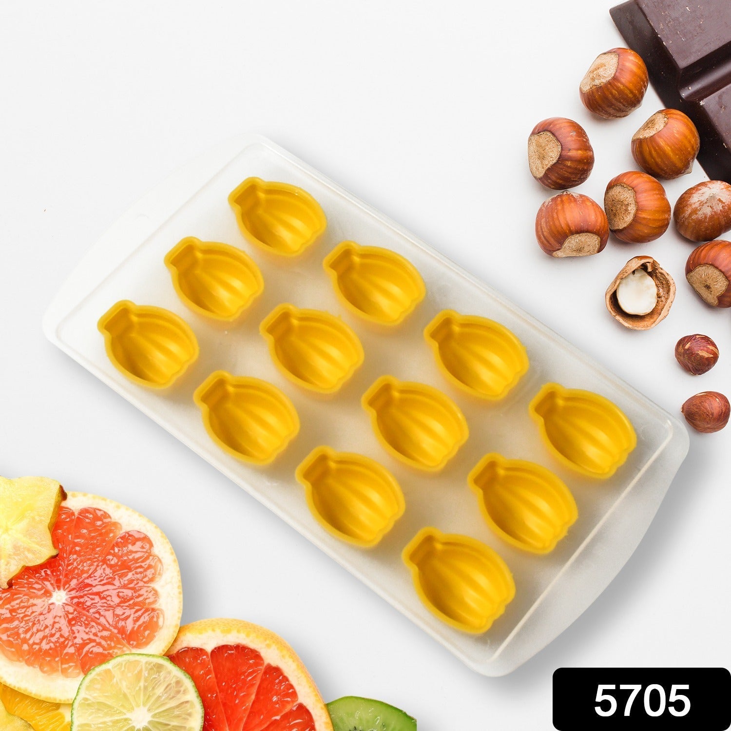 Top view of a flexible silicone fruit ice cube tray with multiple molds ready for freezing.