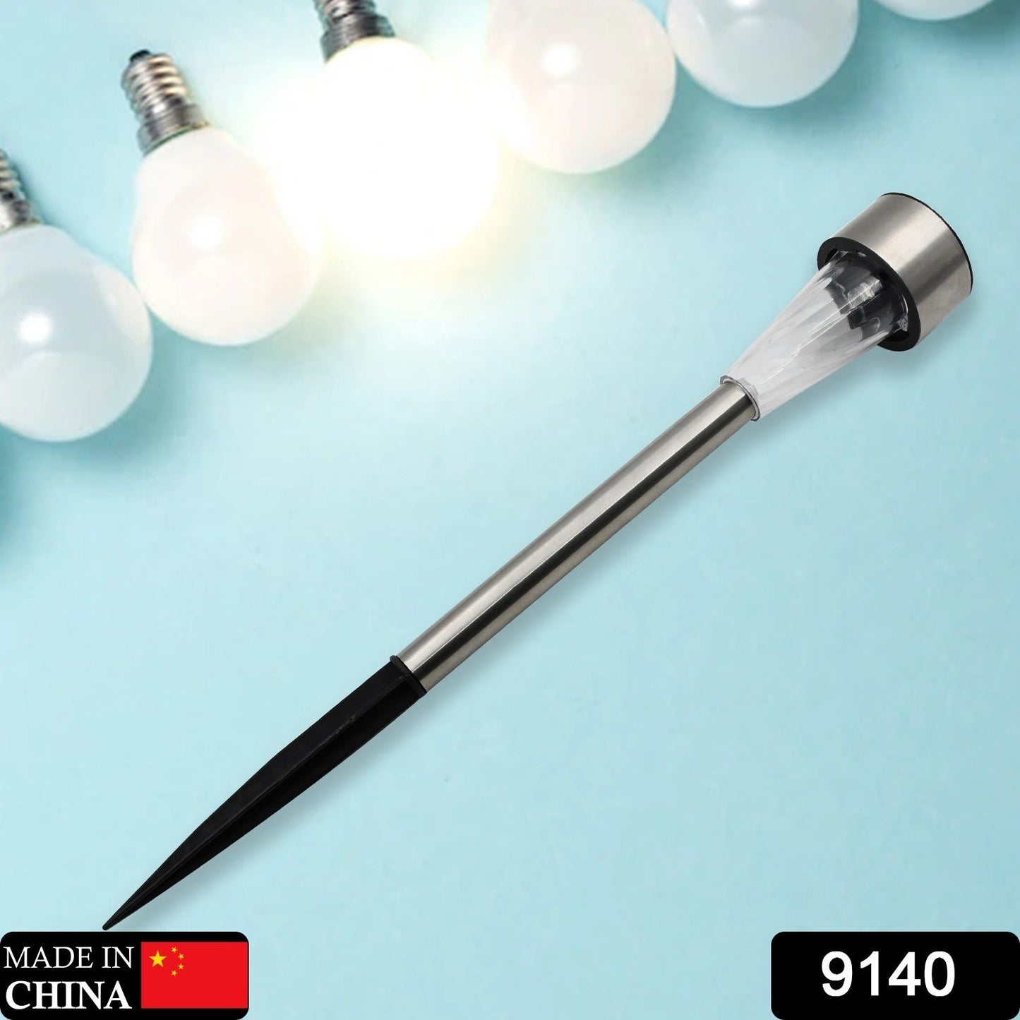 A silver solar LED spike light with a black ground stake is displayed on a light blue background with glowing bulbs.