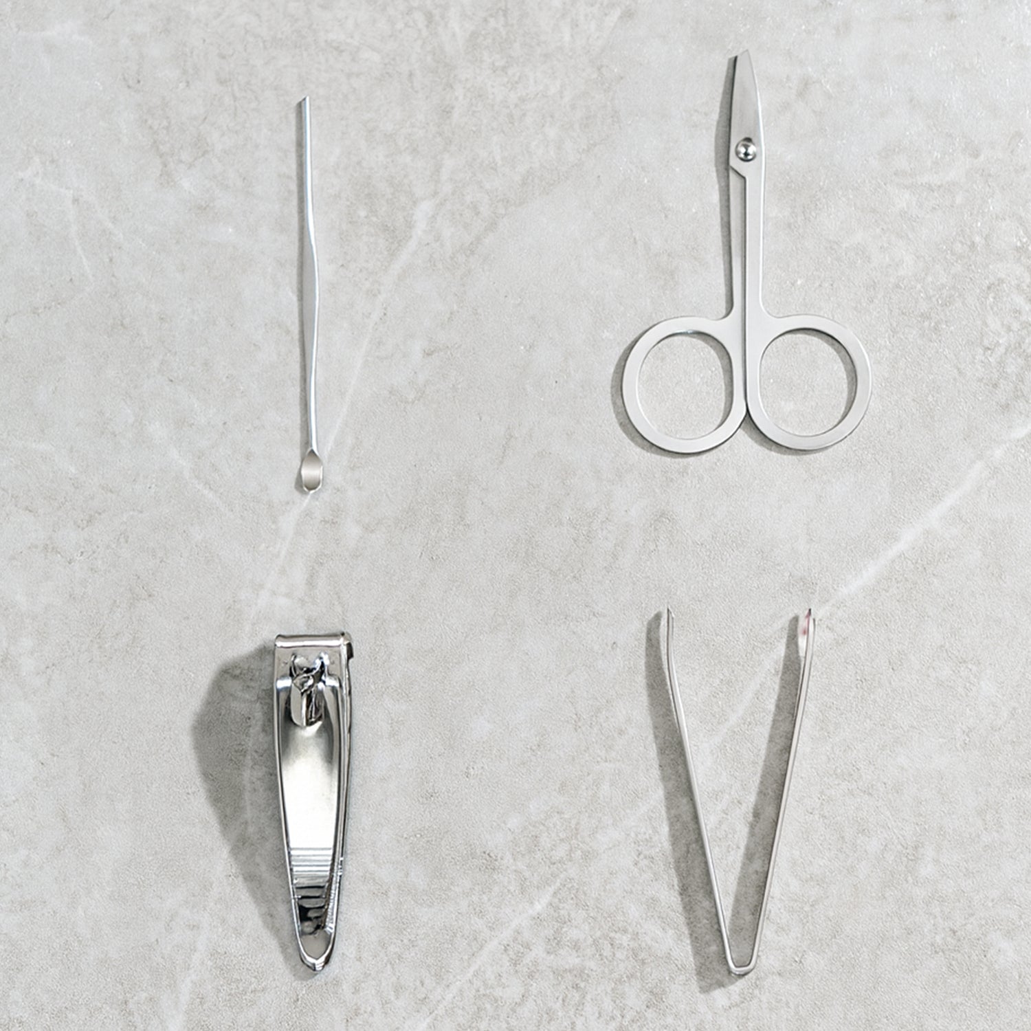 The AuriGlam 4-piece stainless steel nail clipper set displayed in its open case.