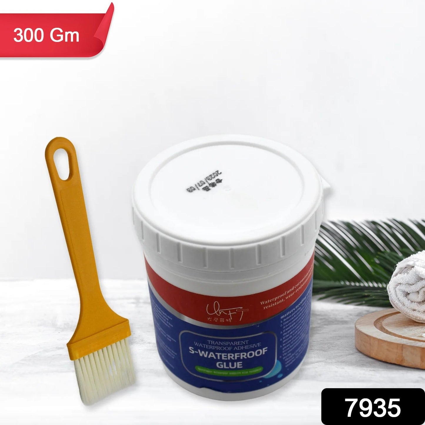Clear waterproof glue being applied to an outdoor surface with a brush for leak protection.