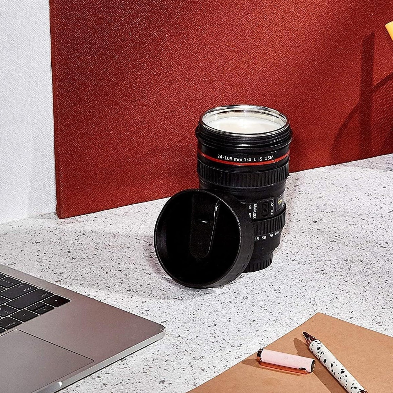 Multiple camera lens coffee mugs stacked, showing the product from various angles.