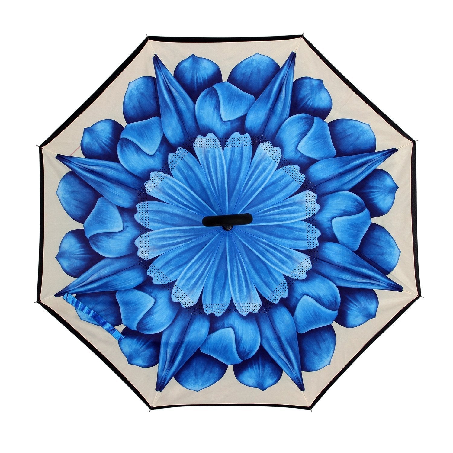 The open canopy of a reverse umbrella reveals a large, intricate blue floral design on a light background.