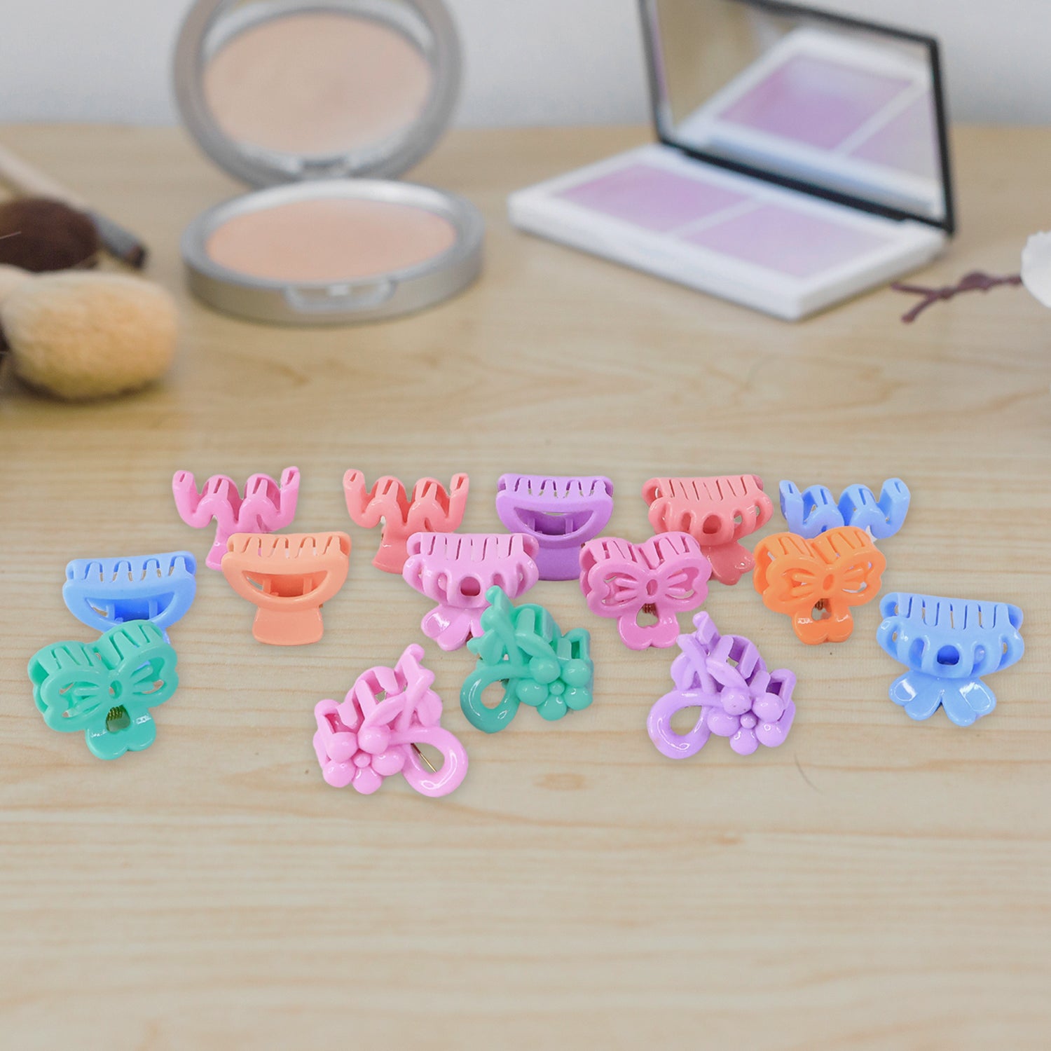 Three different colourful mini hair clips arranged creatively for display.