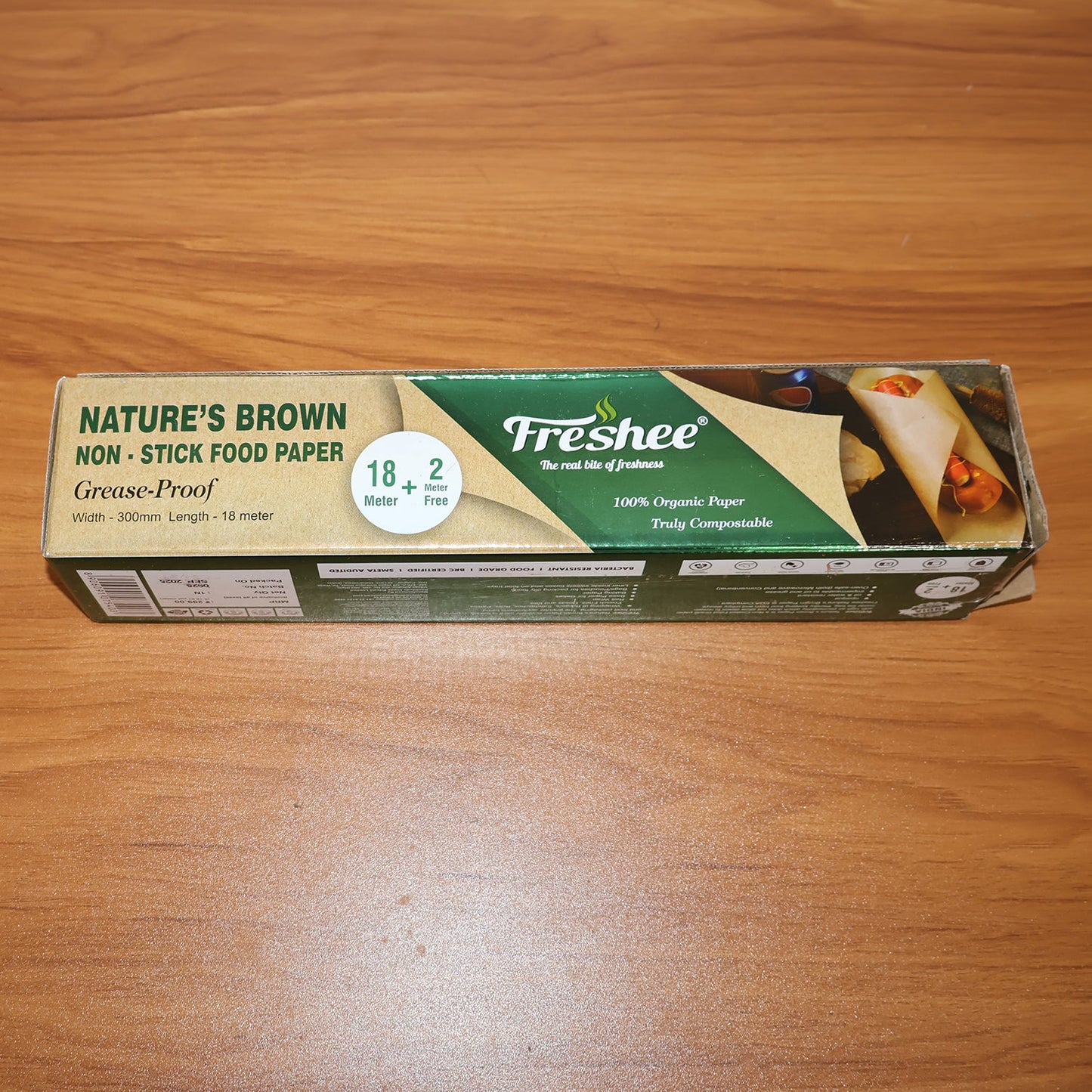 Lifestyle image showing non-stick brown food paper roll in kitchen setting
