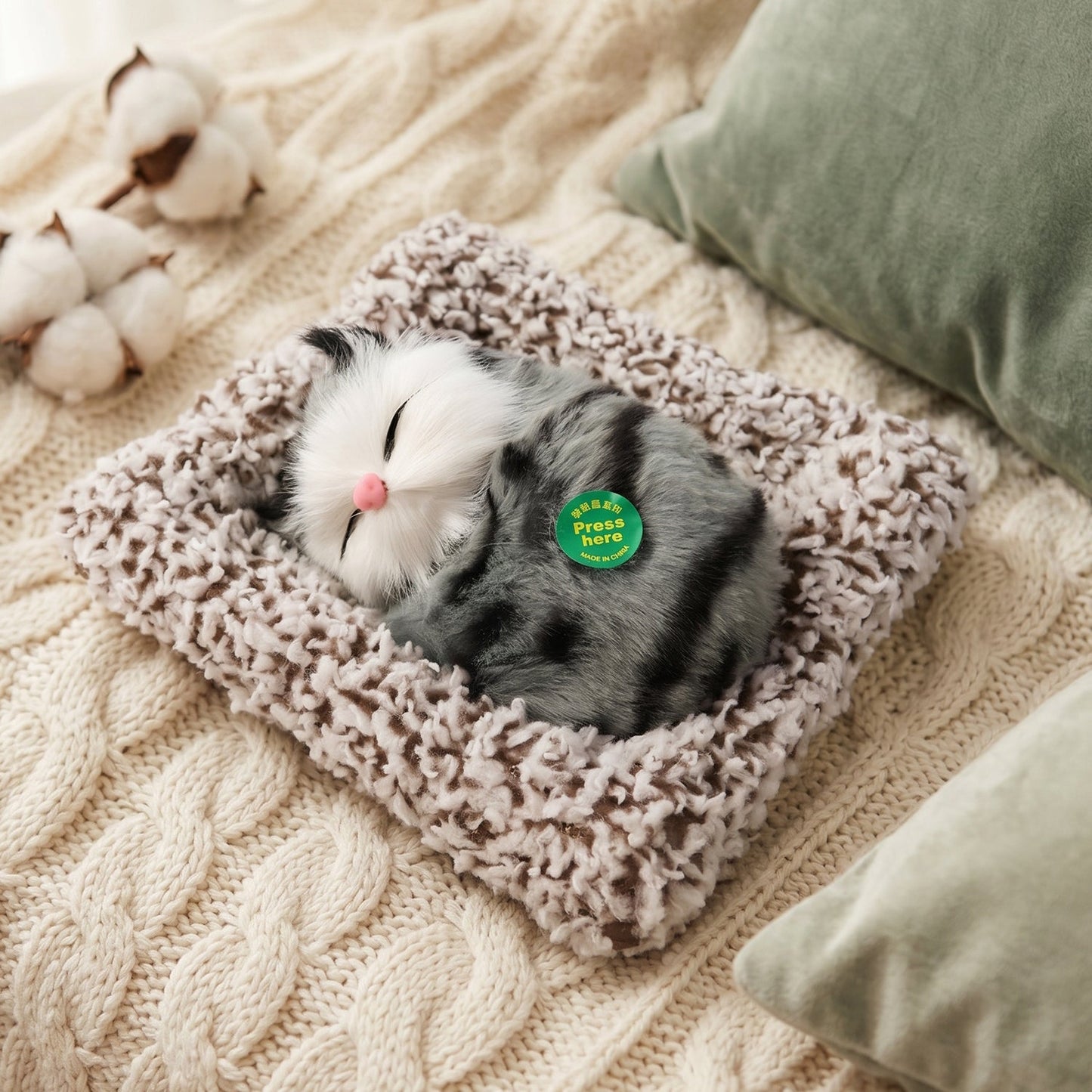 Soft plush cat figurine on table
