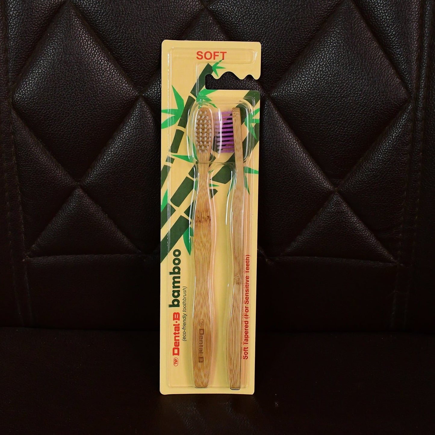Angled view highlighting bamboo toothbrush with medium bristles