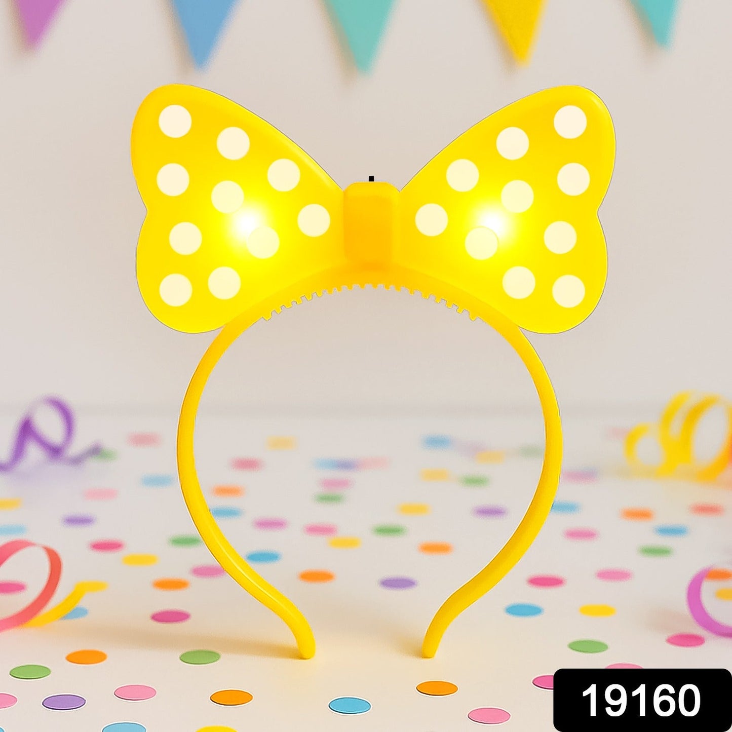 Child wearing LED bow hairband at a lively party event