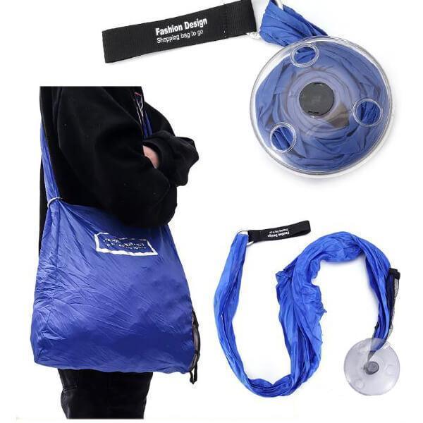 Blue foldable shopping bag in its compact, portable disc form.