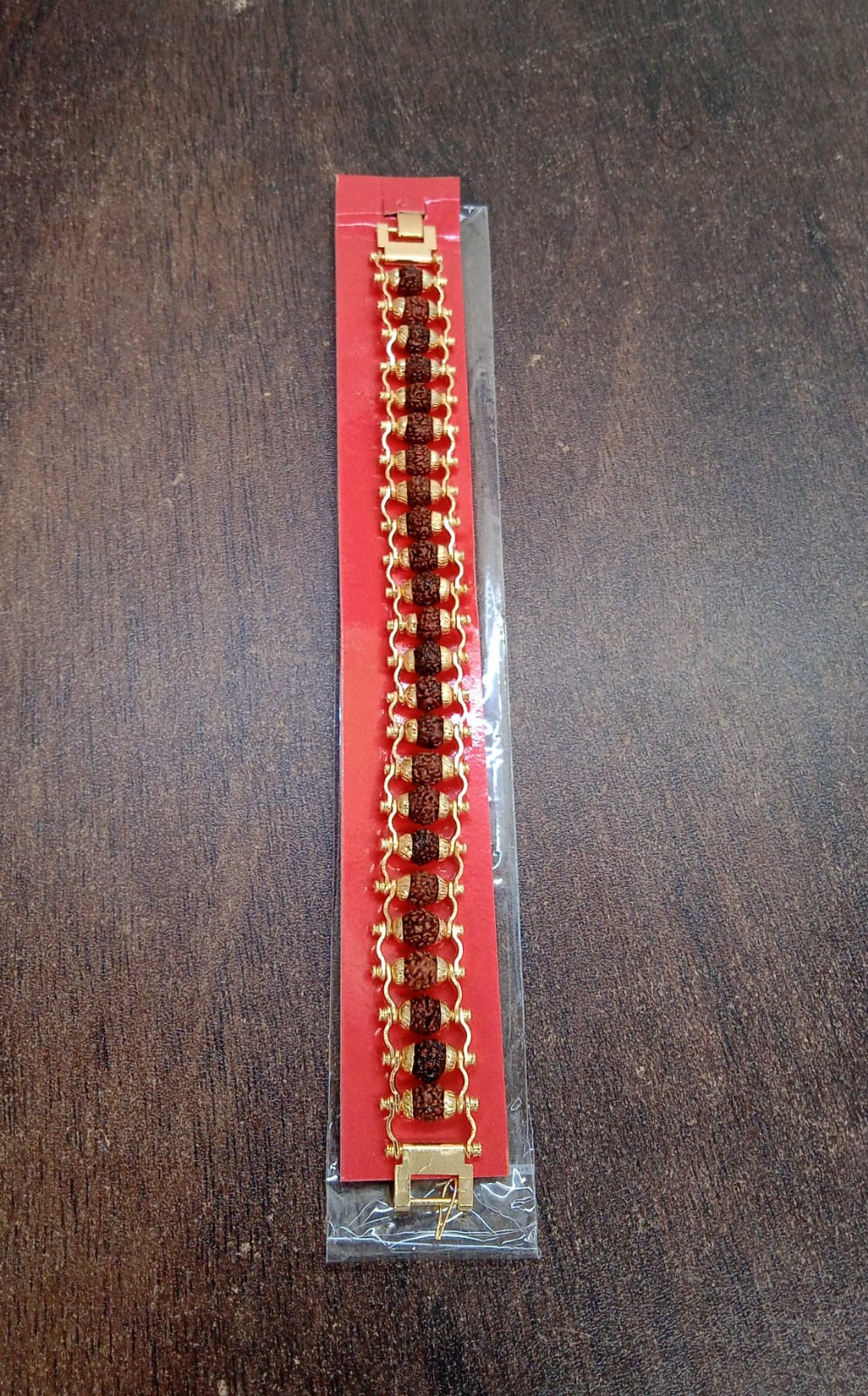 Golden Rudraksha Bracelet presented in its protective and gift-ready packaging.