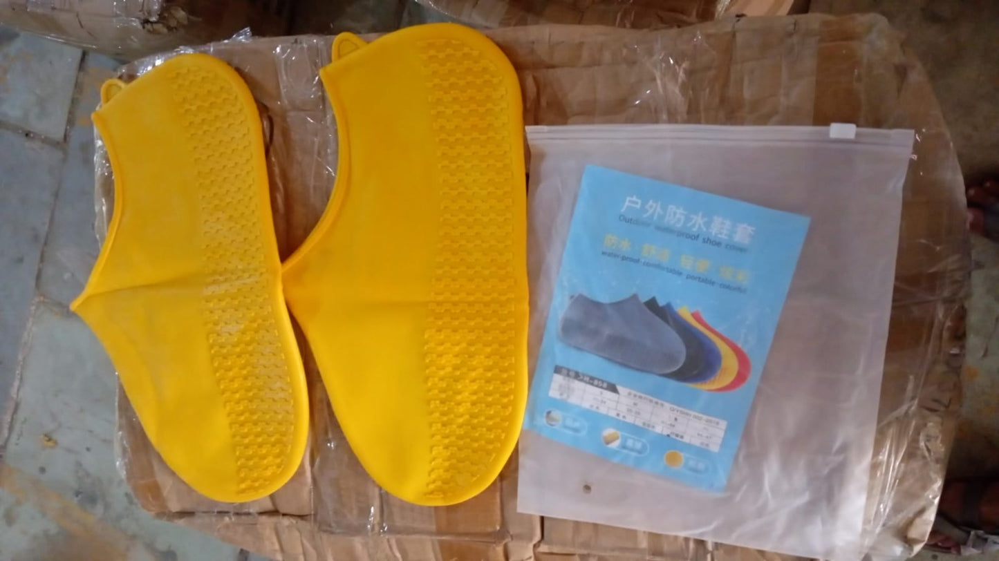 A packaged waterproof silicone shoe cover product is visible through clear plastic, showing a person wearing a blue cover.
