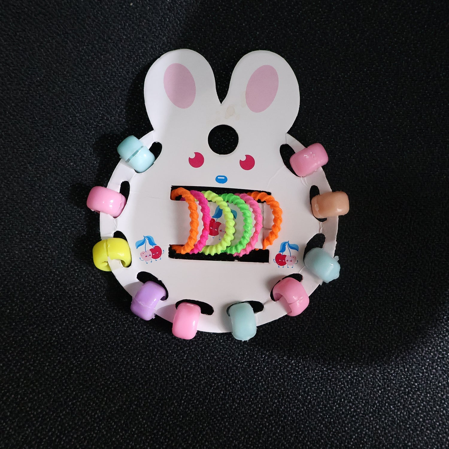 Young girl wearing pastel hairband from girls hair clip set