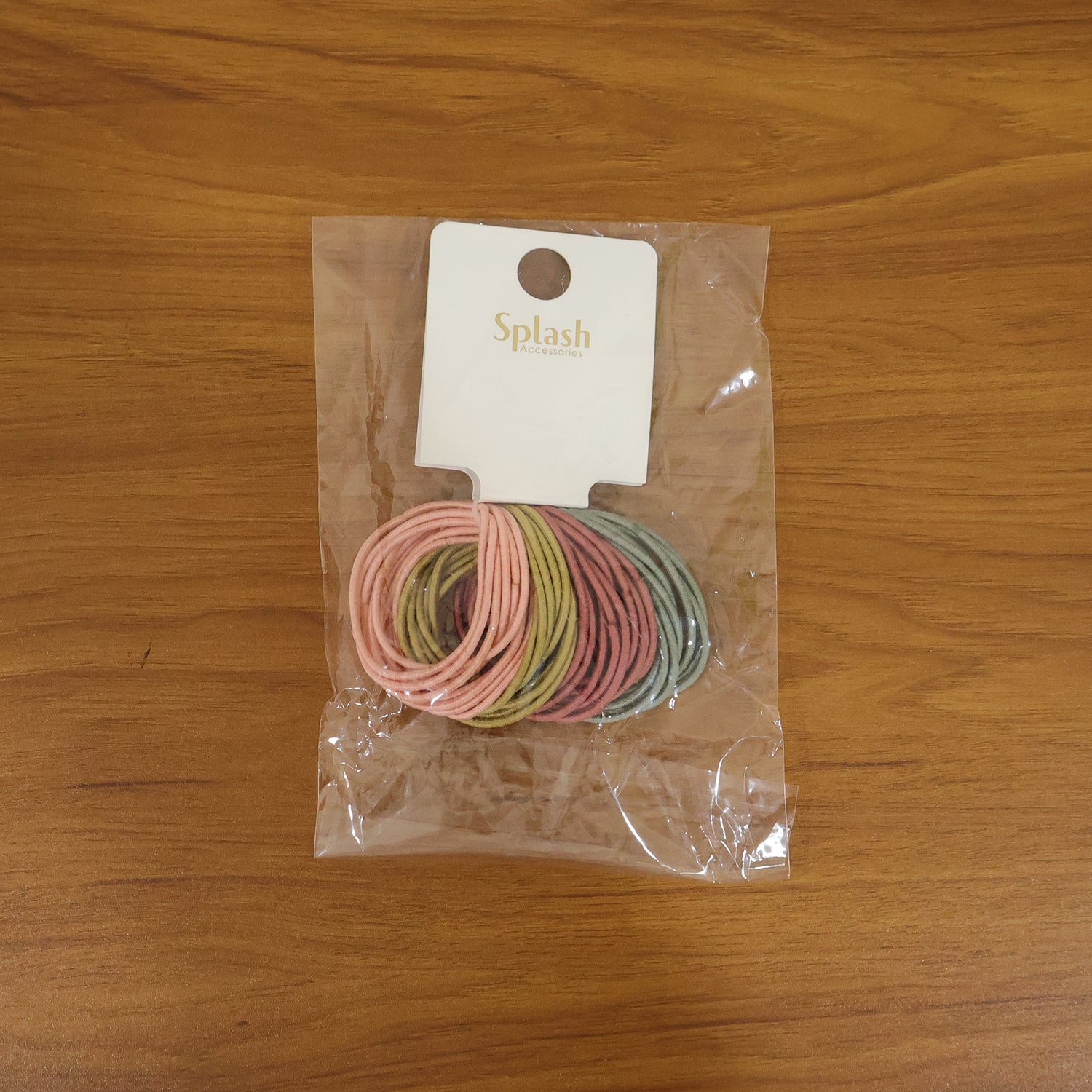 Lifestyle shot featuring an elastic hair band in use, providing a soft and secure hold.