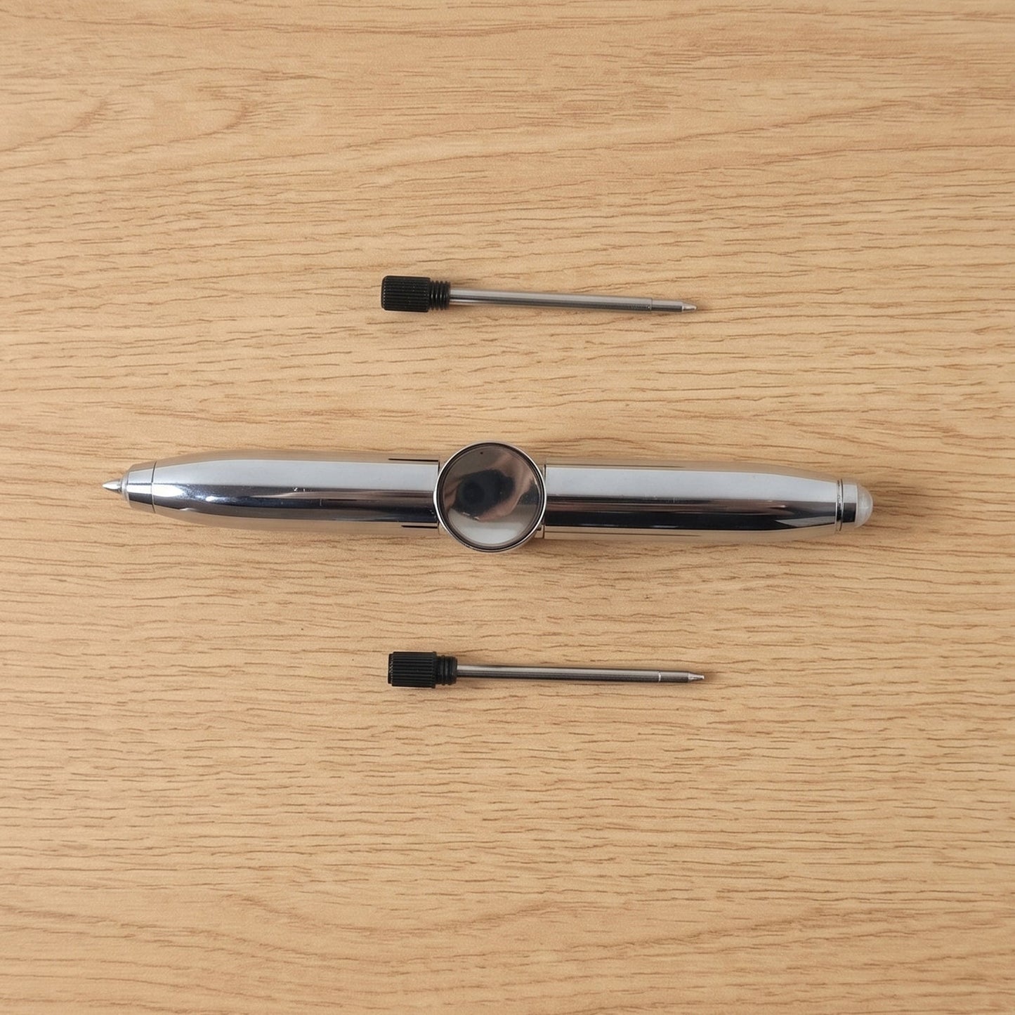 Compact multifunction spinner pen for stress relief and writing