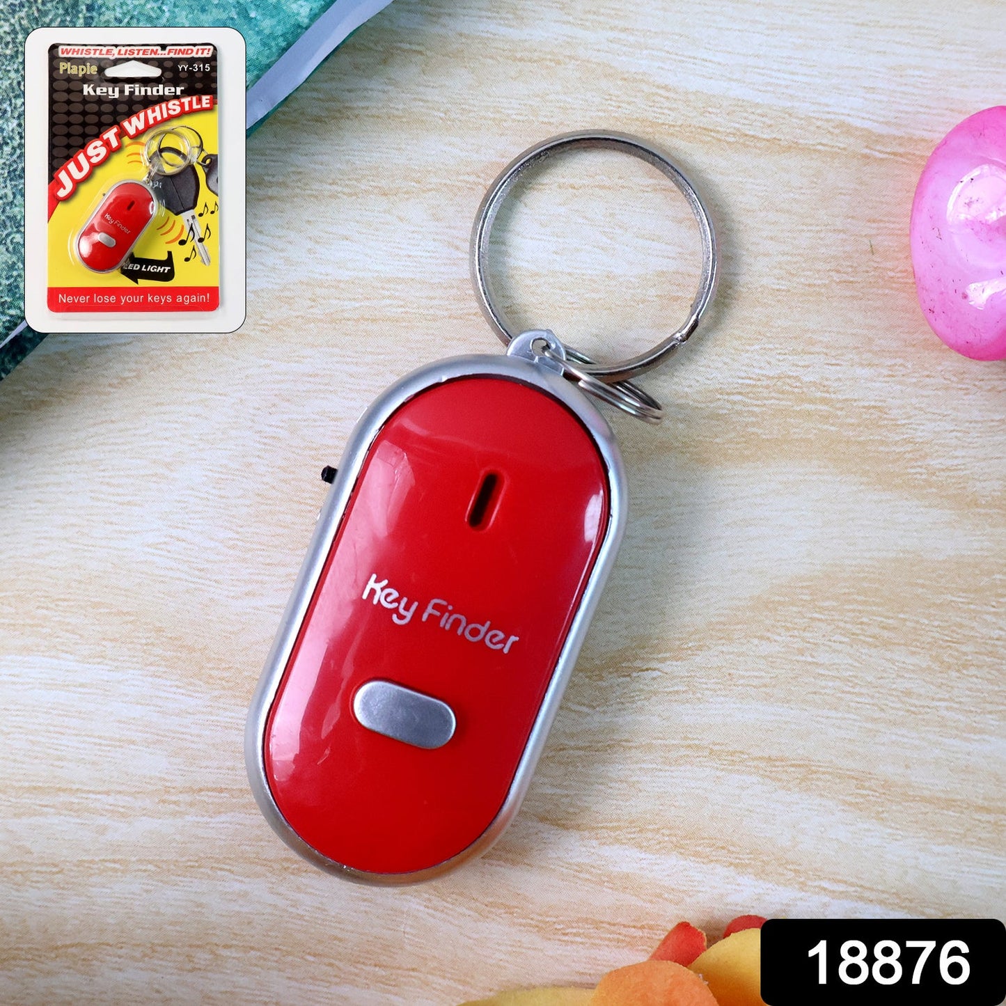 Key Finder with LED light attached to a keychain for easy key locating